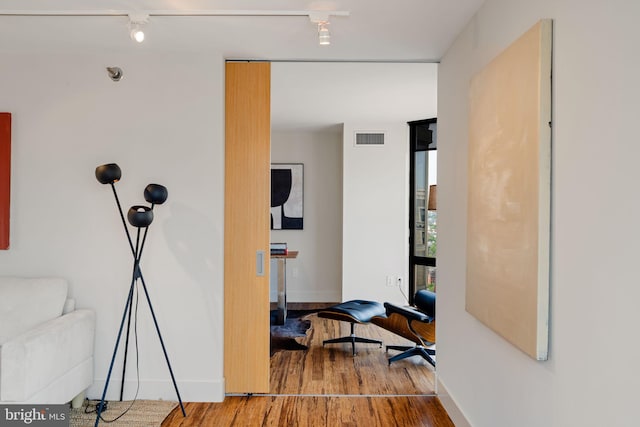 2018 Walnut St Unit 19Gh, Philadelphia, PA 19103 - hallway featuring wood finished floors, rail lighting, and baseboards