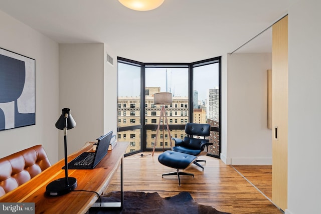 2018 Walnut St Unit 19Gh, Philadelphia, PA 19103 - office space with expansive windows, wood finished floors, a city view, and baseboards