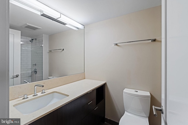 2018 Walnut St Unit 19Gh, Philadelphia, PA 19103 - bathroom featuring toilet, vanity, and tiled shower