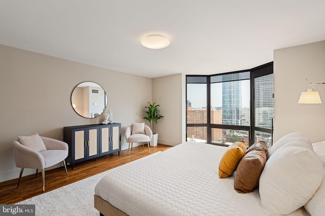 2018 Walnut St Unit 19Gh, Philadelphia, PA 19103 - bedroom featuring wood finished floors, baseboards, and a wall of windows