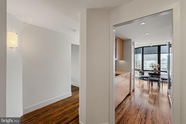 2018 Walnut St Unit 19Gh, Philadelphia, PA 19103 - corridor featuring dark wood-type flooring, floor to ceiling windows, recessed lighting, and baseboards