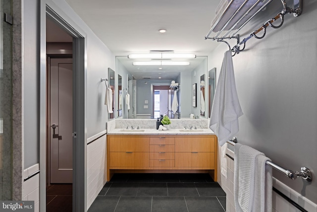 2018 Walnut St Unit 19Gh, Philadelphia, PA 19103 - bathroom with tile patterned floors, double vanity, and wainscoting