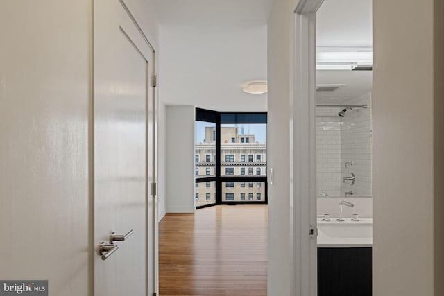 2018 Walnut St Unit 19Gh, Philadelphia, PA 19103 - corridor with wood finished floors and a sink