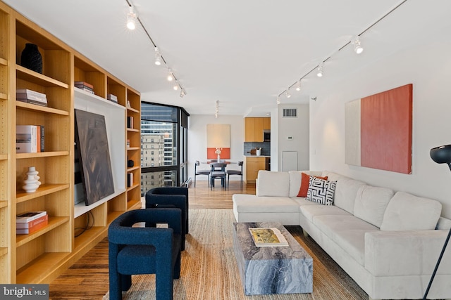 2018 Walnut St Unit 19Gh, Philadelphia, PA 19103 - living area with track lighting and wood finished floors