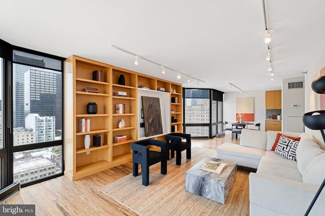 2018 Walnut St Unit 19Gh, Philadelphia, PA 19103 - living area with track lighting and light wood-style flooring