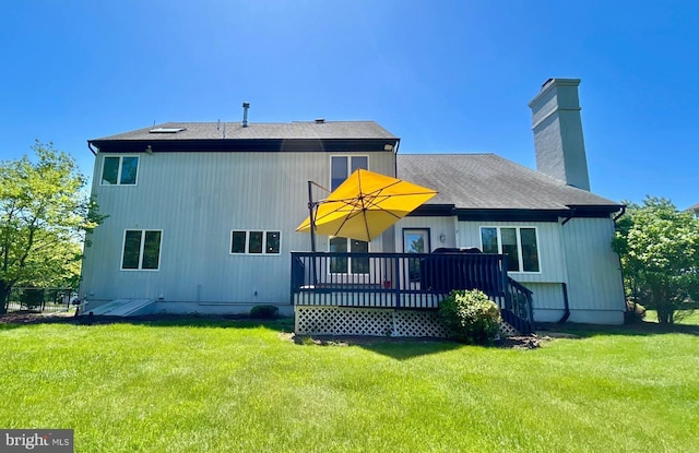 52 Dalton Way, Southampton, PA 18966 - back of house featuring a wooden deck, a yard, a chimney, and a shingled roof