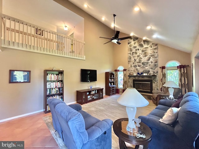 52 Dalton Way, Southampton, PA 18966 - tiled living room with high vaulted ceiling, a ceiling fan, baseboards, and a fireplace