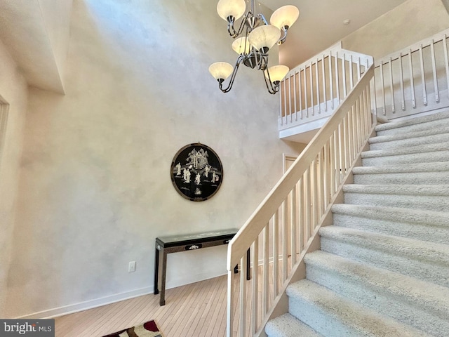 52 Dalton Way, Southampton, PA 18966 - staircase with a chandelier, baseboards, and wood finished floors