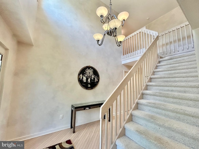 52 Dalton Way, Southampton, PA 18966 - staircase with a chandelier, baseboards, wood finished floors, and a high ceiling