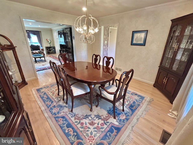 52 Dalton Way, Southampton, PA 18966 - dining area featuring light wood-style floors, a chandelier, crown molding, and baseboards