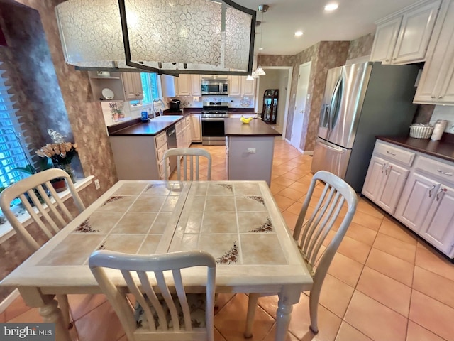 52 Dalton Way, Southampton, PA 18966 - kitchen with appliances with stainless steel finishes, a sink, dark countertops, a center island, and recessed lighting