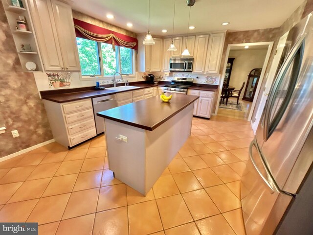 52 Dalton Way, Southampton, PA 18966 - kitchen featuring appliances with stainless steel finishes, a sink, dark countertops, light tile patterned floors, and recessed lighting