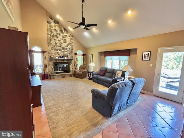 52 Dalton Way, Southampton, PA 18966 - living room with light tile patterned flooring, plenty of natural light, ceiling fan, high vaulted ceiling, and a stone fireplace