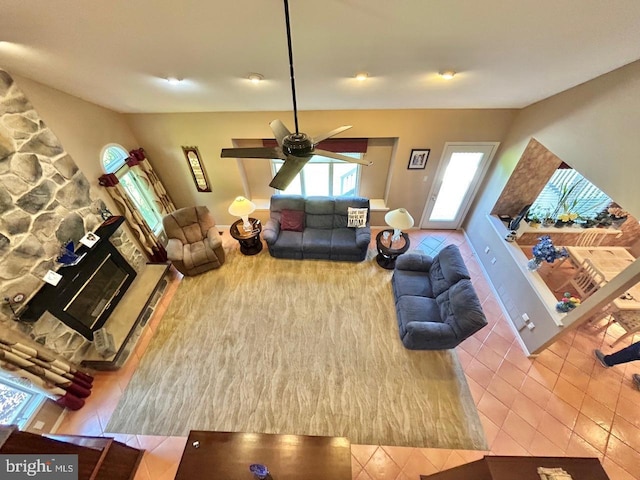52 Dalton Way, Southampton, PA 18966 - living room with tile patterned flooring, ceiling fan, a fireplace, and lofted ceiling