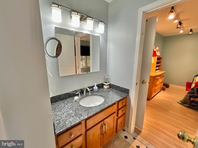 52 Dalton Way, Southampton, PA 18966 - bathroom featuring rail lighting, baseboards, wood finished floors, and vanity