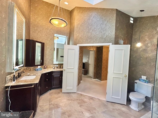 52 Dalton Way, Southampton, PA 18966 - full bathroom featuring wallpapered walls, a high ceiling, toilet, double vanity, and tile patterned flooring