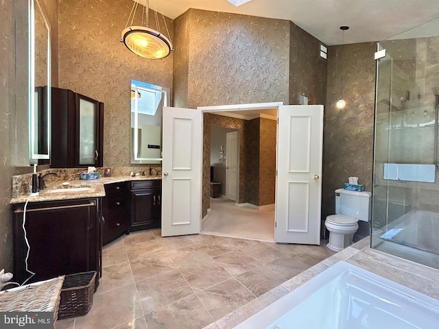 52 Dalton Way, Southampton, PA 18966 - full bathroom featuring toilet, a stall shower, double vanity, wallpapered walls, and tile patterned floors