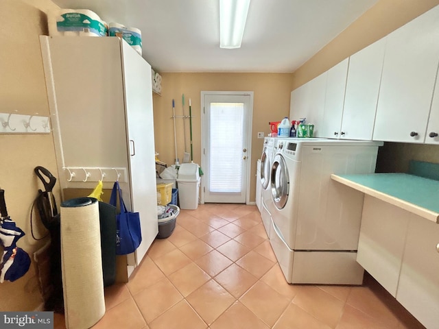 52 Dalton Way, Southampton, PA 18966 - clothes washing area with cabinet space, washing machine and clothes dryer, and light tile patterned floors