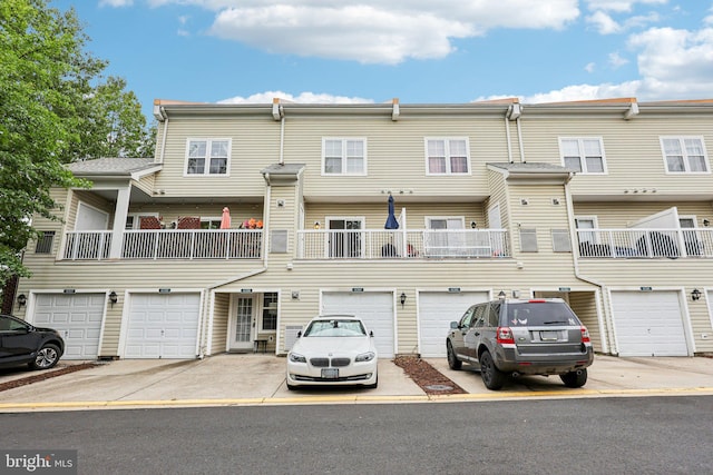 42397 Goldenseal Sq, Brambleton, VA 20148 - view of property featuring a garage and driveway