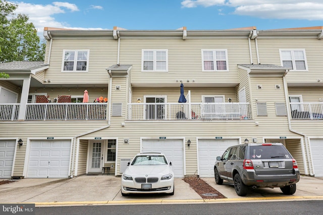 42397 Goldenseal Sq, Brambleton, VA 20148 - back of property featuring a garage and driveway