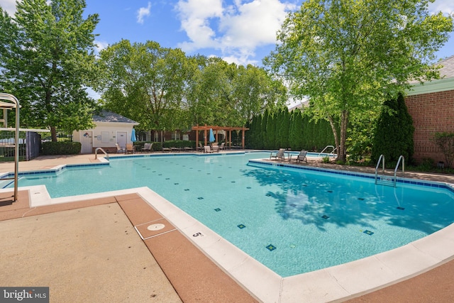 42397 Goldenseal Sq, Brambleton, VA 20148 - community pool with fence, a patio area, and a pergola