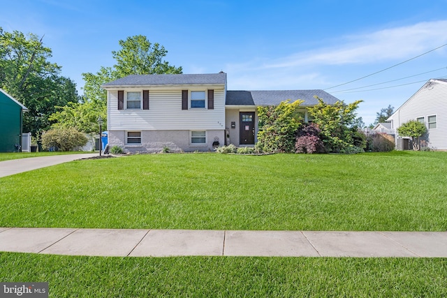 split level home with a front yard