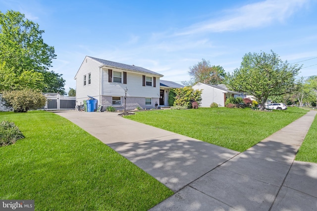 split level home featuring concrete driveway