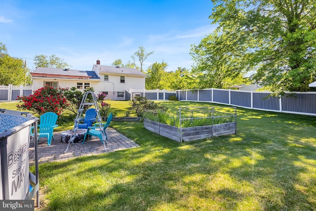view of yard with a garden and a patio