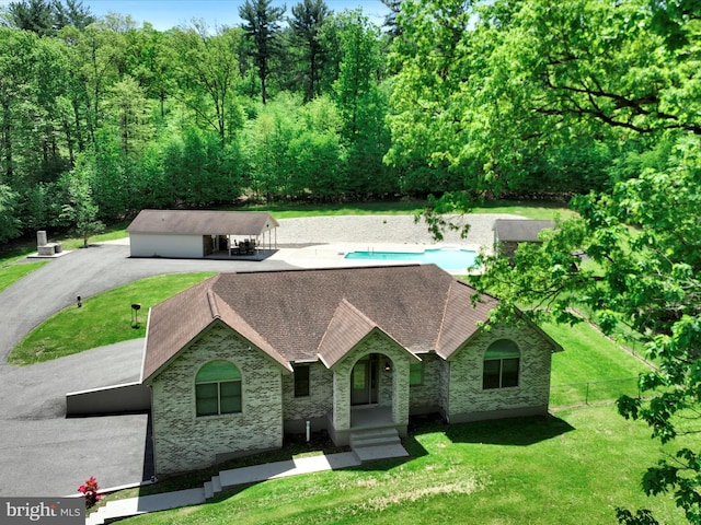 773 S Rte 183, Schuylkill Haven, PA 17972 - view of front of house featuring roof with shingles, a carport, and stone siding