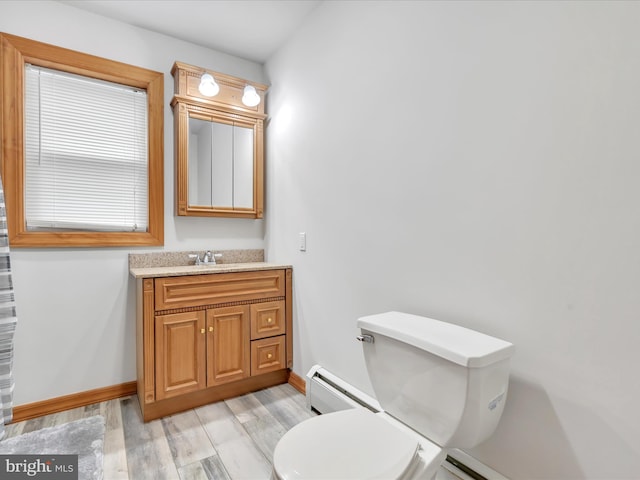 773 S Rte 183, Schuylkill Haven, PA 17972 - bathroom featuring a baseboard radiator, wood finished floors, baseboards, vanity, and toilet