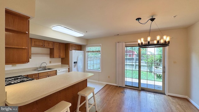 208 Eastern Ave, Annapolis, MD 21403 - kitchen with white appliances, a sink, baseboards, and light wood-style floors
