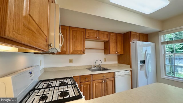 208 Eastern Ave, Annapolis, MD 21403 - kitchen with white appliances, a sink, light countertops, and brown cabinets