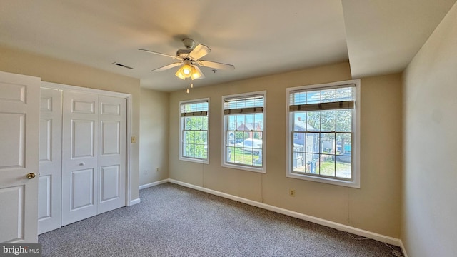 208 Eastern Ave, Annapolis, MD 21403 - unfurnished bedroom with carpet, baseboards, a closet, and a ceiling fan
