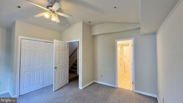 208 Eastern Ave, Annapolis, MD 21403 - unfurnished bedroom featuring vaulted ceiling, carpet, baseboards, a closet, and a ceiling fan