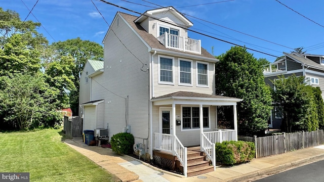 208 Eastern Ave, Annapolis, MD 21403 - view of front of property featuring a balcony, a porch, roof with shingles, and central air condition unit