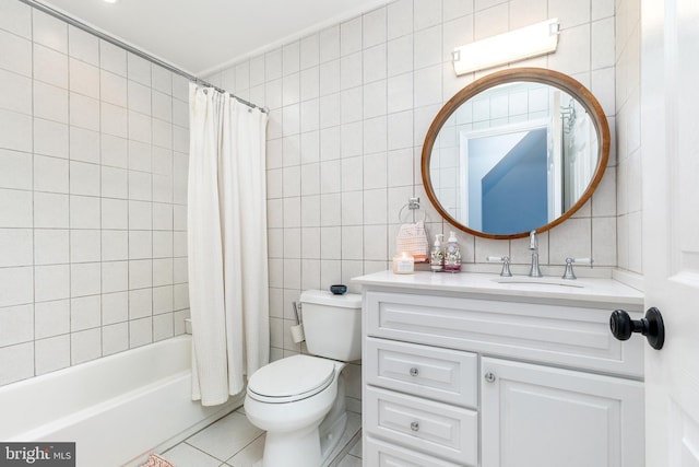 2113 Montrose St, Philadelphia, PA 19146 - full bathroom with tile walls, toilet, vanity, shower / bathtub combination with curtain, and tile patterned flooring