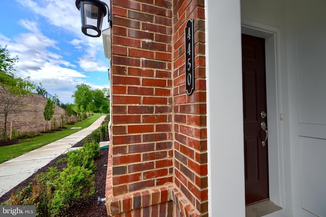 property entrance with brick siding