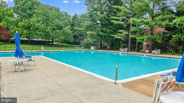 3100 S Manchester St Unit 224, Falls Church, VA 22044 - community pool with fence, a patio area, and view of wooded area
