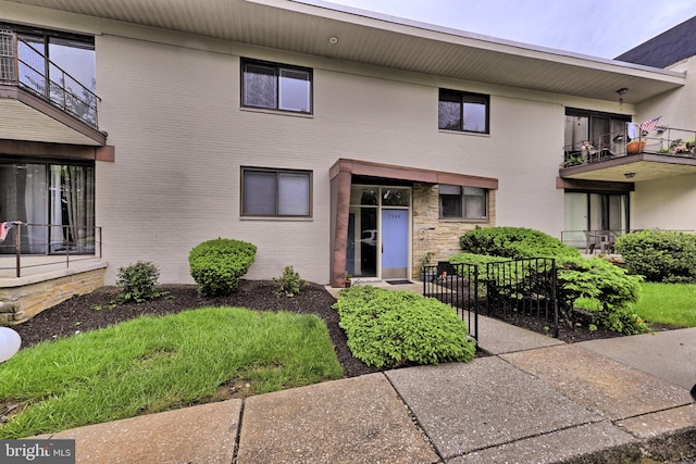 view of front of home featuring brick siding