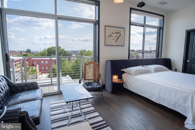 2550 17th St NW Unit 604, Washington, DC 20009 - bedroom with dark wood-style floors and access to exterior