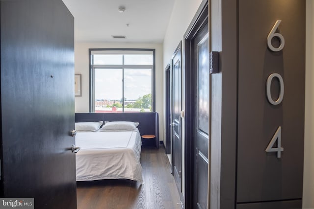 2550 17th St NW Unit 604, Washington, DC 20009 - bedroom featuring wood finished floors