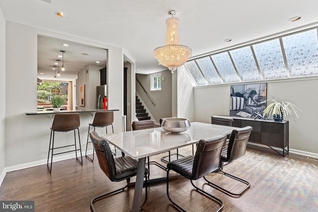 dining area featuring stairway, baseboards, wood finished floors, and recessed lighting