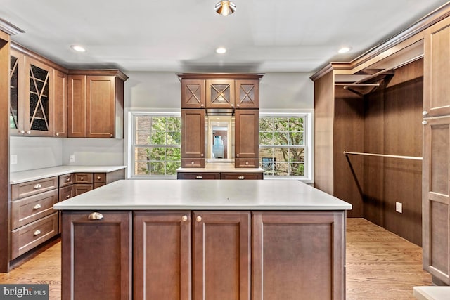 kitchen with plenty of natural light, light countertops, light wood-style floors, and recessed lighting