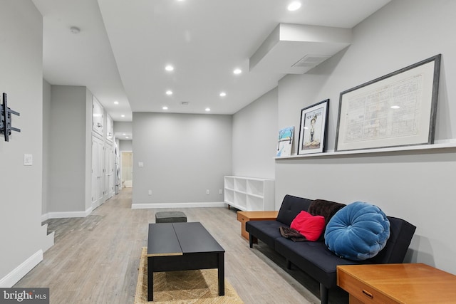 sitting room featuring light wood-style floors, recessed lighting, and baseboards