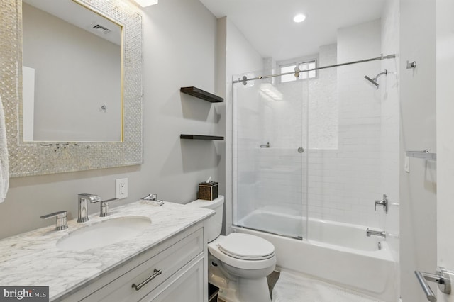 bathroom featuring toilet, vanity, combined bath / shower with glass door, and recessed lighting