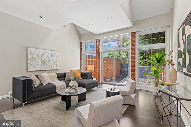living area with wood finished floors, baseboards, and recessed lighting