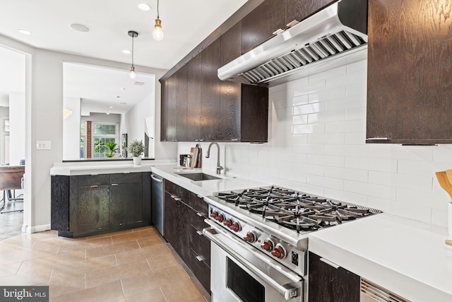 kitchen featuring stainless steel appliances, a sink, extractor fan, dark brown cabinetry, and recessed lighting
