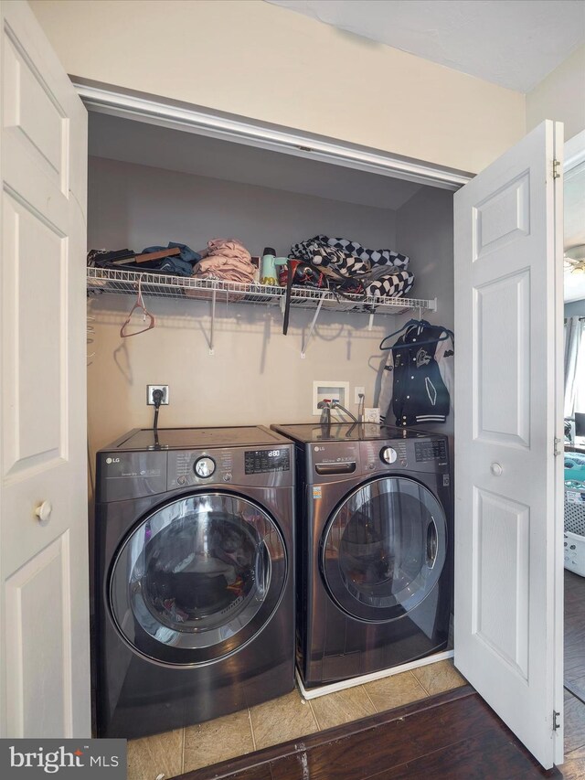 67 Tinning Ct, Hedgesville, WV 25427 - washroom featuring washing machine and clothes dryer and wood finished floors