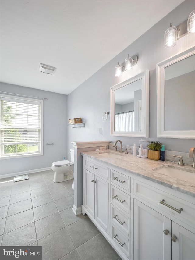 67 Tinning Ct, Hedgesville, WV 25427 - full bathroom with tile patterned floors, toilet, double vanity, and baseboards