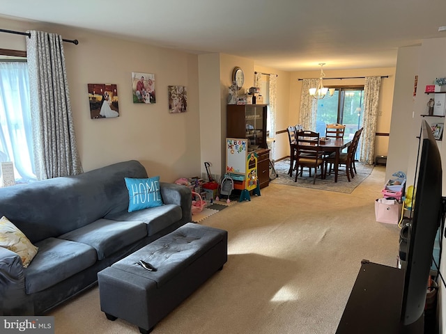 living room featuring a chandelier and light colored carpet